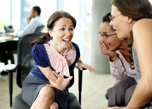 Businesswomen gossiping in office Original Filename: 85406525.jpg